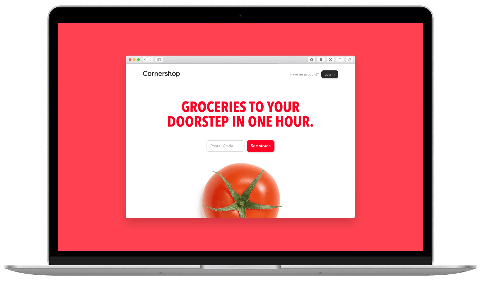 MacBook Air displaying a website with big and bold letters in red, typeset in Avenir Next, that reads “Groceries from your doorstep in one hour” on top of a giant tomato.